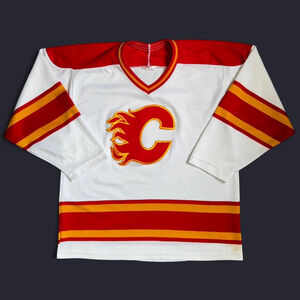 Vintage white, red, and gold Calgary Flames jersey